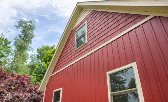 {8" board and batten siding in Mountain Berry, one of the options when considering vinyl siding vs fiber cement}