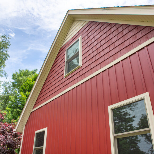 {8" board and batten siding in Mountain Berry, one of the options when considering vinyl siding vs fiber cement}