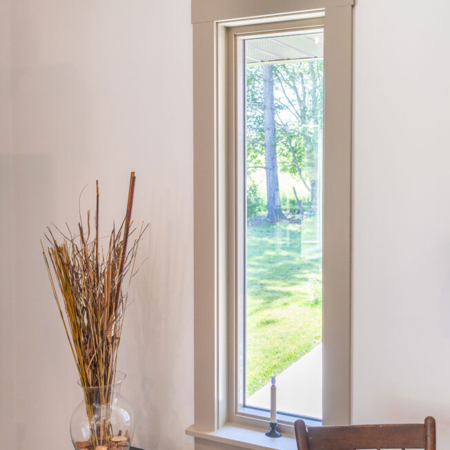 {Inside view of an Aspect tall, narrow picture window in Sandstone beige}
