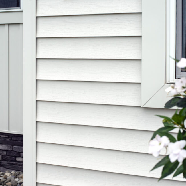 {Closeup of HeartTech white vinyl siding}