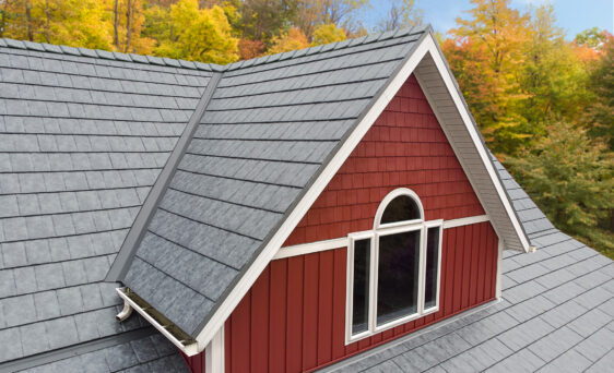 {Ironstone Slate metal roofing on red farmhouse style home}