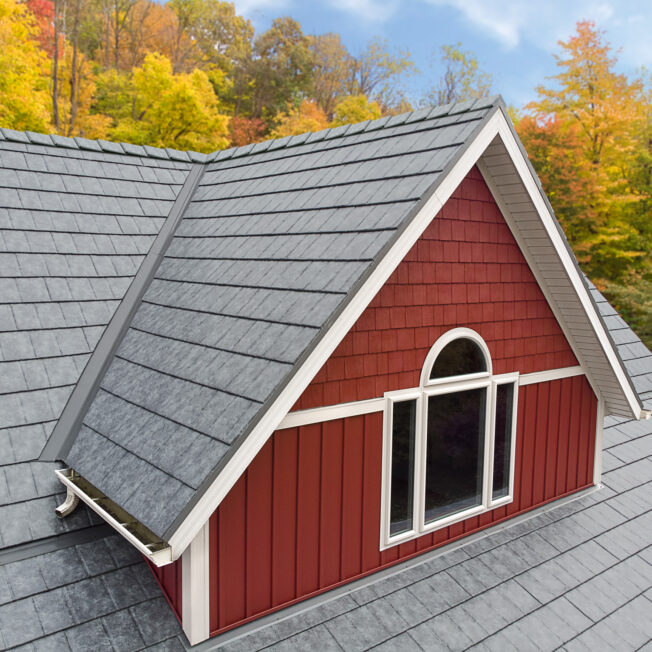 {Ironstone Slate metal roofing on red farmhouse style home}