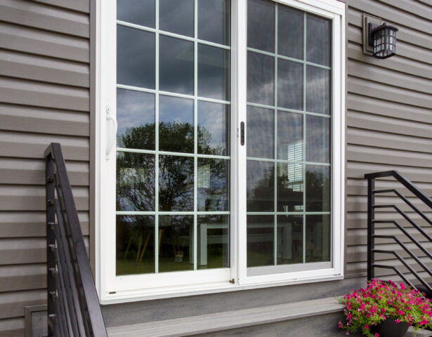 {Exterior view of a ProVia Endure™ Sliding Patio Door in White with Internal Colonial Grids}