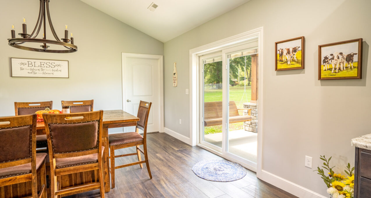{Endure white vinyl patio doors with internal blinds in a bright, cheerful kitchen}