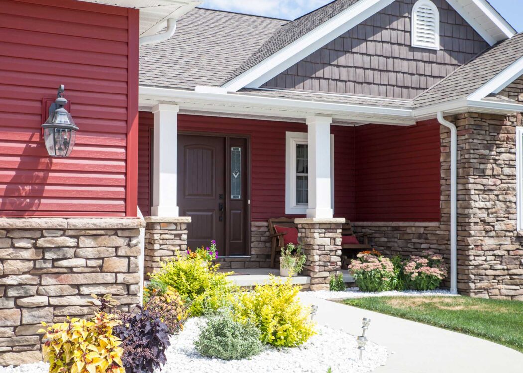 {Home featuring HeartTech vinyl siding colors in the color Mountain Berry; example of dark colors of vinyl siding}