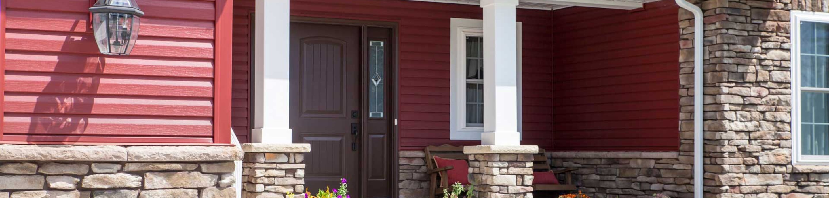 Home featuring HeartTech vinyl siding colors in the color Mountain Berry; example of dark colors of vinyl siding