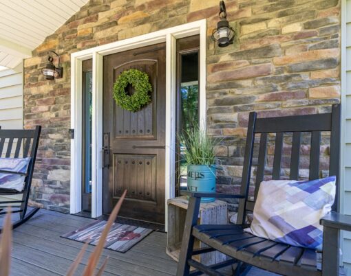 {Signet fiberglass front door and sidelites with Knotty Alder skin in dark Espresso stain}