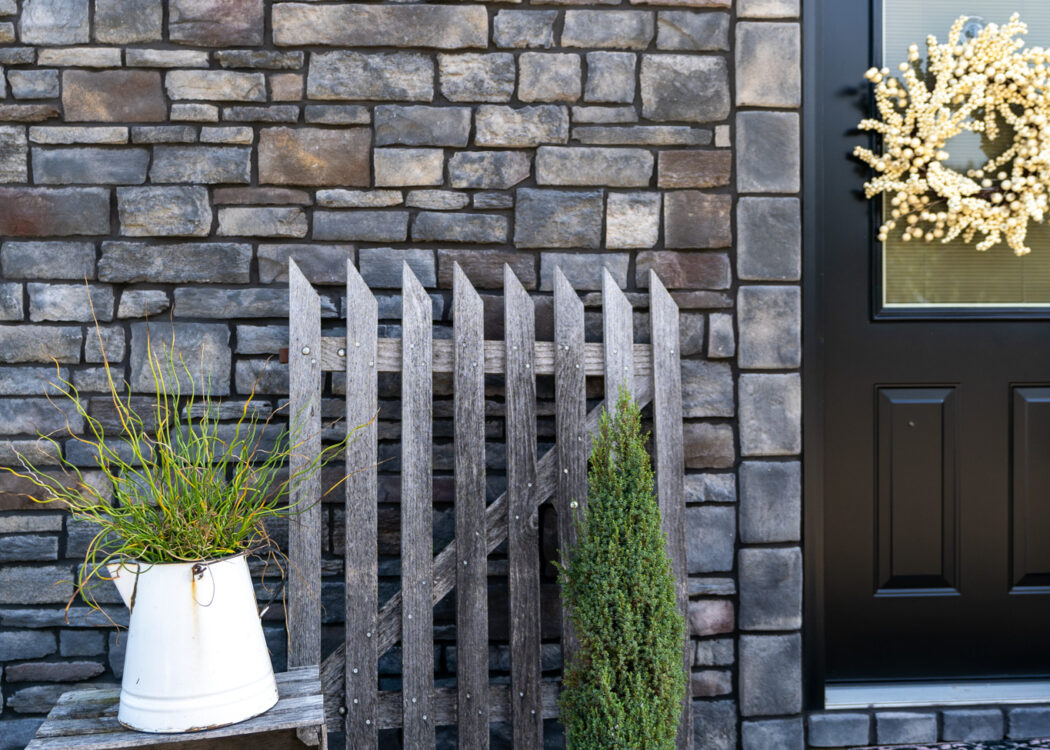 {Home exterior featuring ProVia Terra Cut manufactured stone veneer, example of ProVia stone on a home exterior}