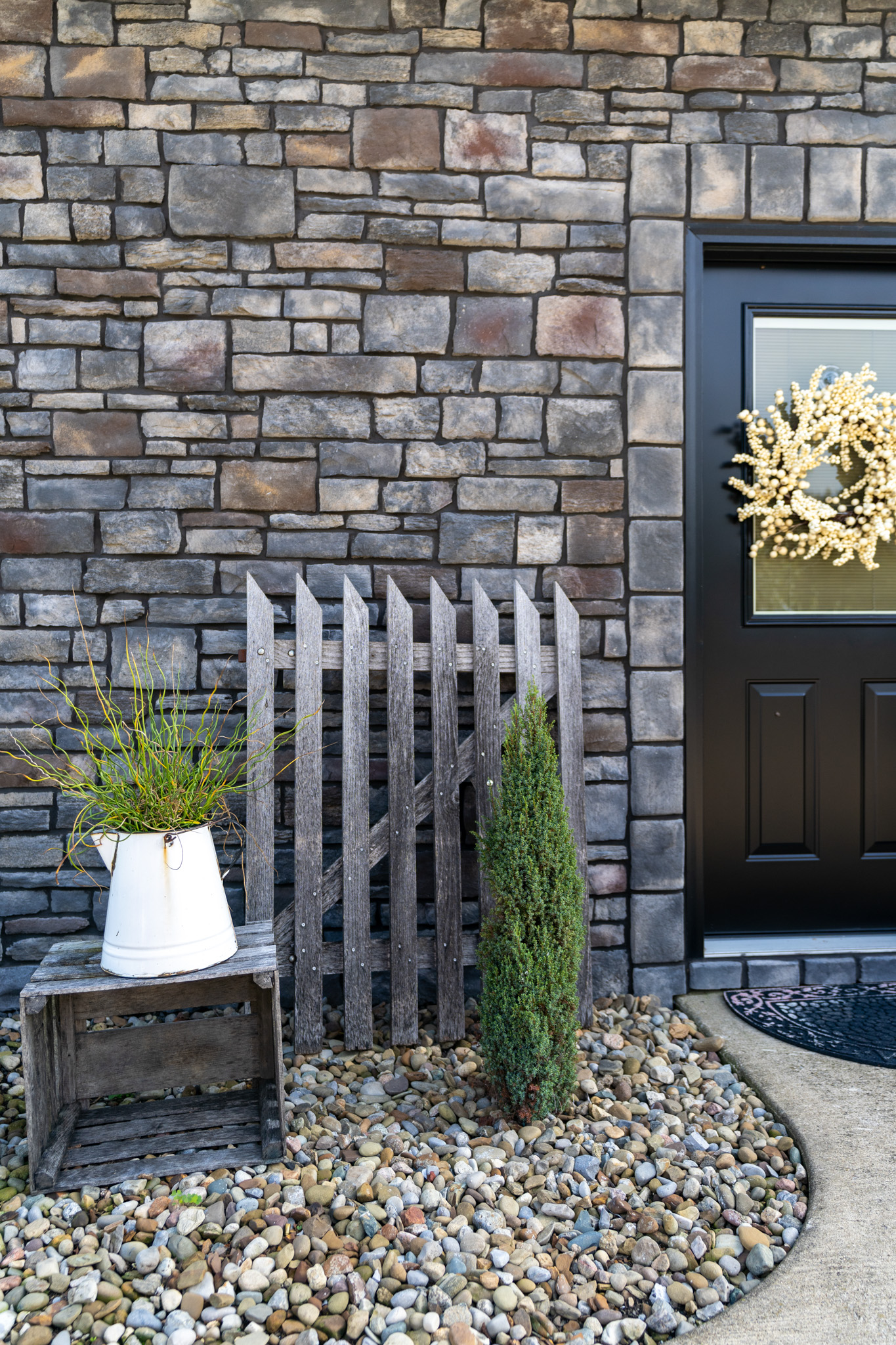 Home exterior featuring ProVia Terra Cut manufactured stone veneer, example of ProVia stone on a home exterior