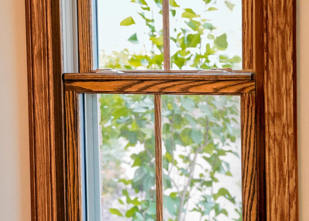{Aeris double hung wood-clad windows in Caramel with colonial grids}