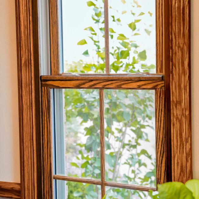{Aeris double hung wood-clad windows in Caramel with colonial grids}