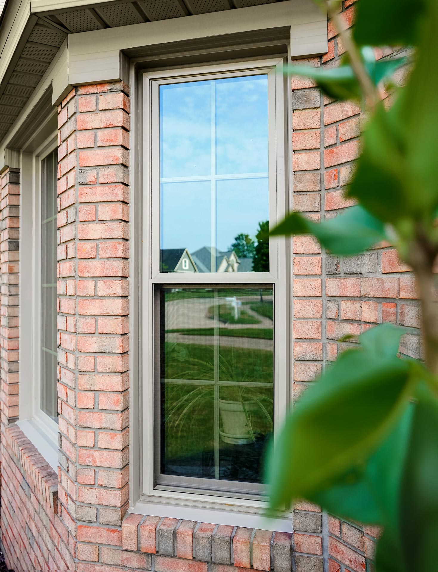 Aeris™ Double Hung Windows in Sandstone with Colonial Grids