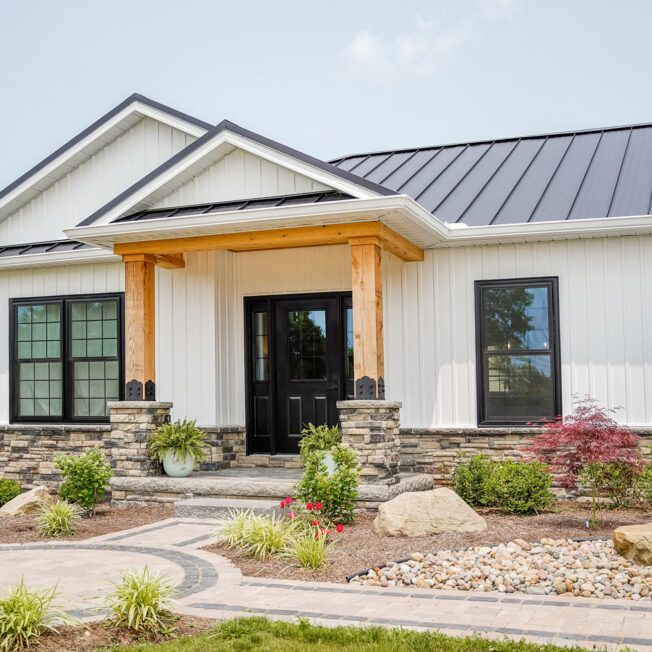 {Cedar Peaks® vinyl Board ‘n Batten in White on a craftsman-style home}