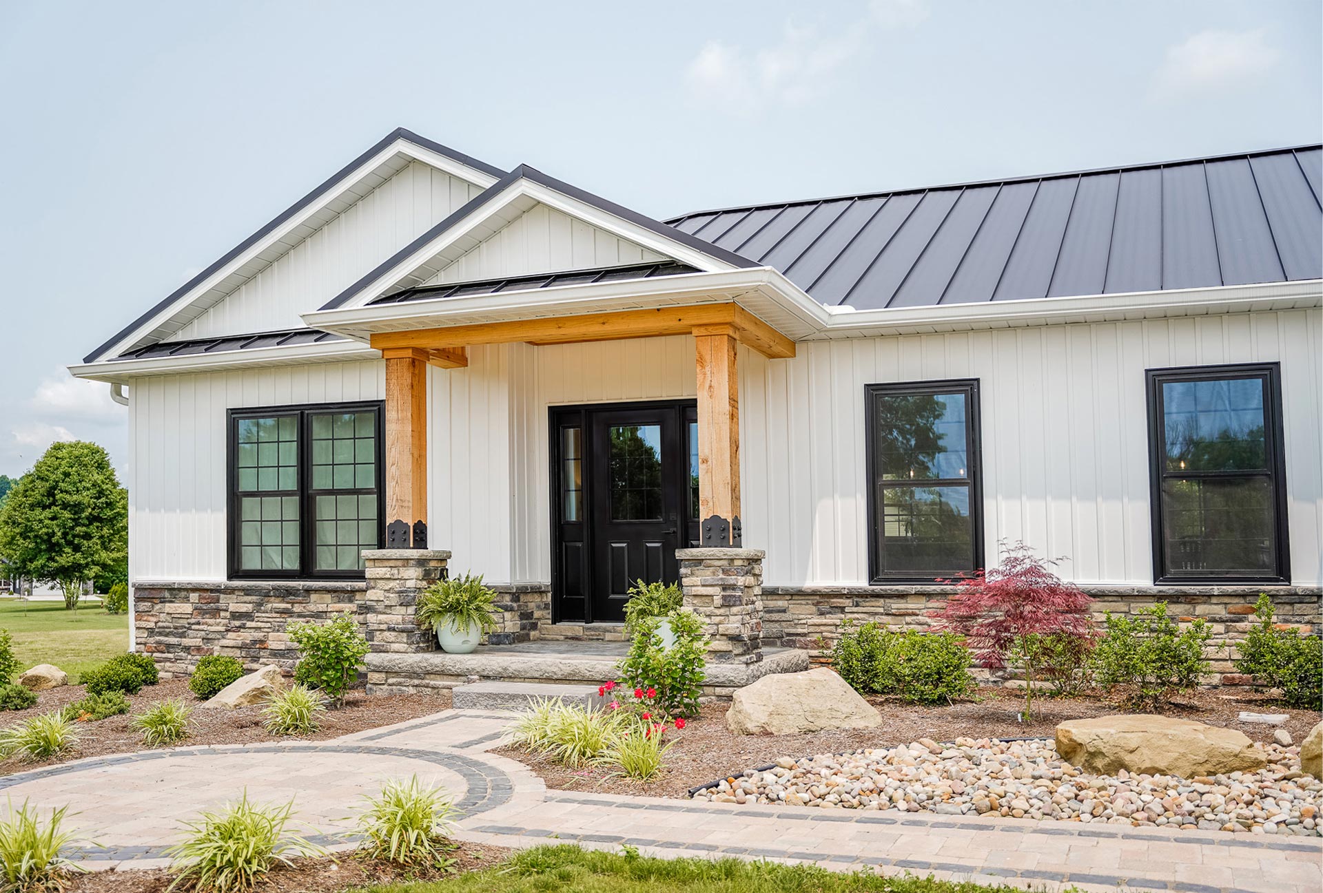 {Cedar Peaks® vinyl Board ‘n Batten in White on a craftsman-style home}
