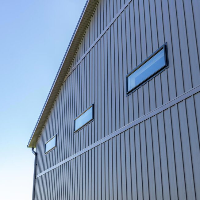 {CedarMAX insulated 8” board and batten in the color Nightfall, a dark gray}