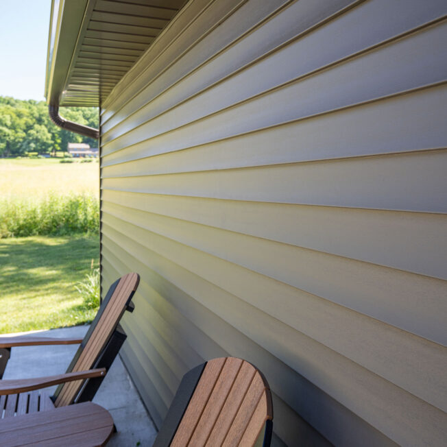 {Cedar Peaks wood grain vinyl siding in Timberline}
