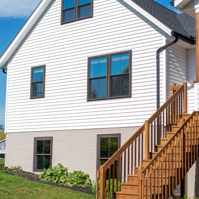 {Cedar Peaks wood grain vinyl siding in White, example of vinyl siding that looks like wood grain}