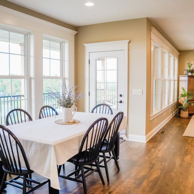 {Interior view of Endure™ Double Hung Windows in White with Cottage Grids in a dining room}