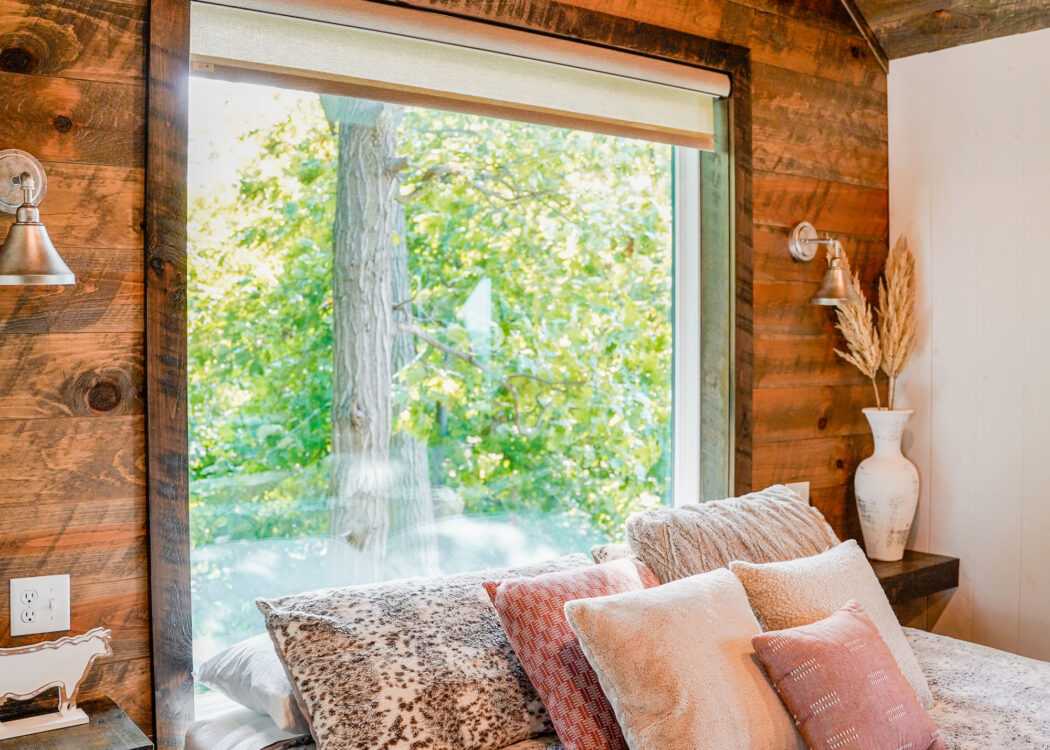 {Endure replacement picture windows in a cabin with a view of trees in the woods}