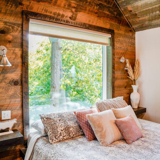 {Endure replacement picture windows in a cabin with a view of trees in the woods}