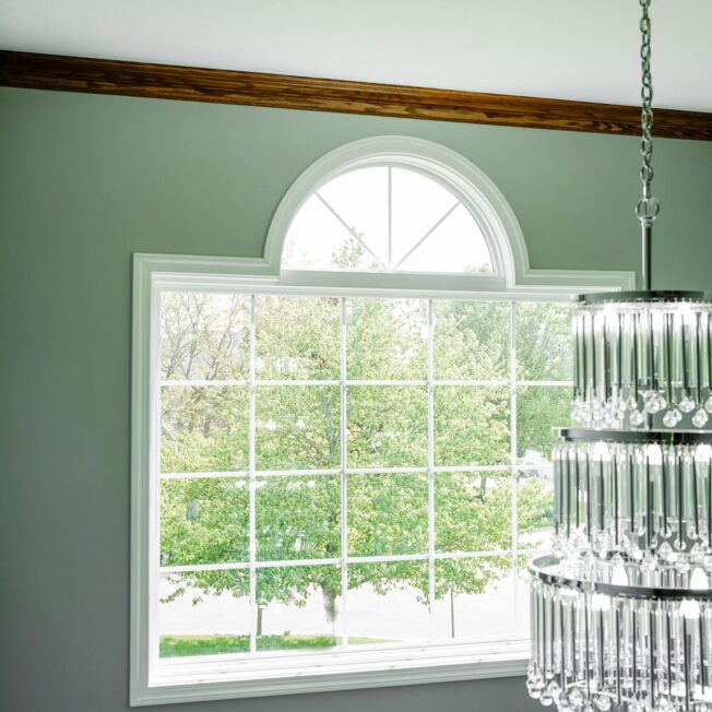 {Inside view of Endure™ Picture and Shaped Windows in White with Colonial Grids}