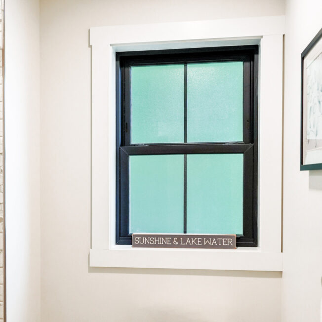 {Black double hung bathroom windows with privacy glass}