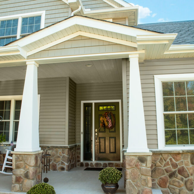 {ProVia Fieldstone  Manufactured Stone knee wall on a home exterior in the color Old Dominion}