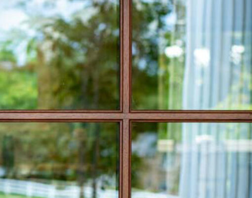 Closeup view of a ProVia Signet 440-2P entry door in Pecan with Simulated Divided Lites and clear glass