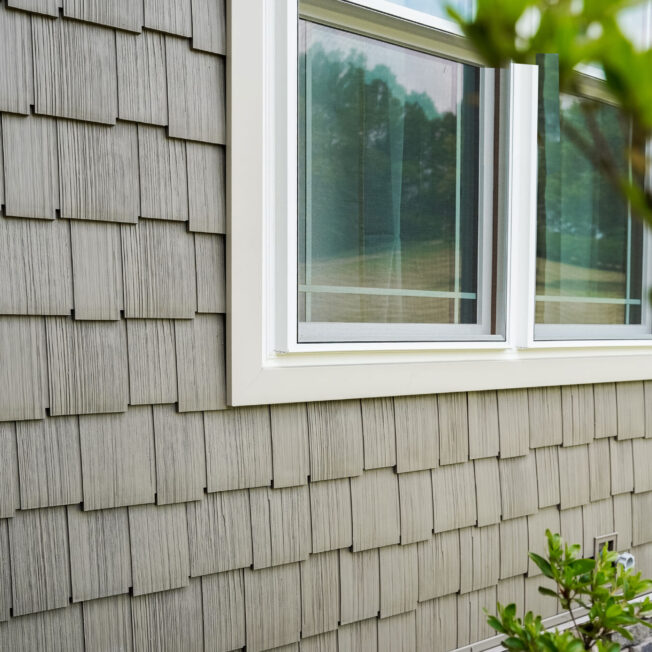 {Closeup of Harbor Mill shingle and shake siding in the color Pueblo on a house}