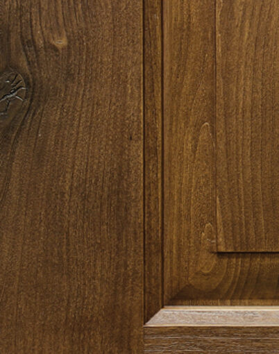 {Closeup example of a Knotty Alder skin for Embarq and Signet fiberglass woodgrain textured door}