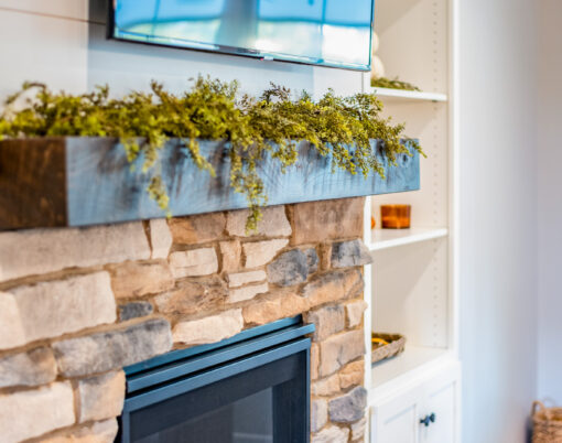 {Inside image of a stone fireplace featuring ProVia's Ledgestone profile in Brighton, example of stone fireplaces, Ledgestone stone veneer for fireplaces}