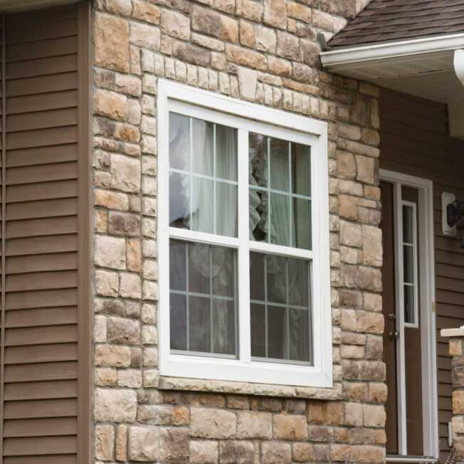 {Amherst limestone veneer on the exterior of a home, example of limestone in ProVia's manufactured stone gallery}