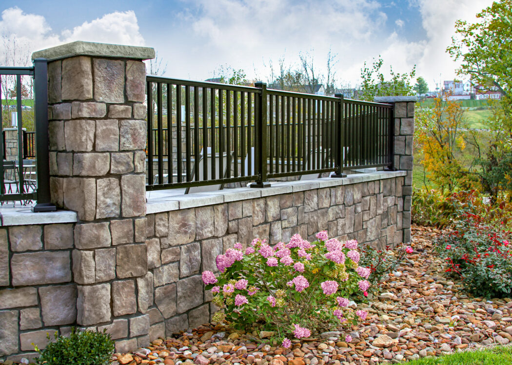 {Outdoor patio area featuring Natura Cut ProVia manufactured stone veneer in Fernwood showing how ProVia stone can be featured in different outdoor applications}