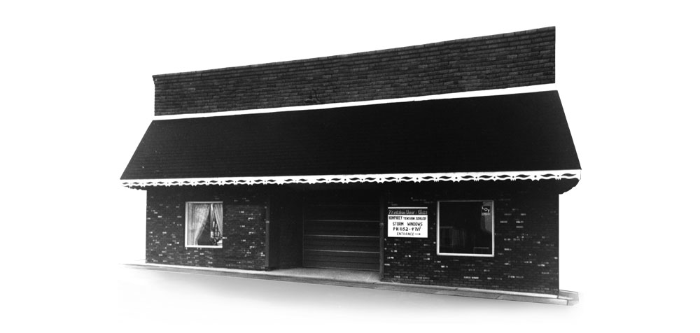 Black and white image of the old Precision Door Building in Sugarcreek, Ohio, around 1977, part of the ProVia® company history.