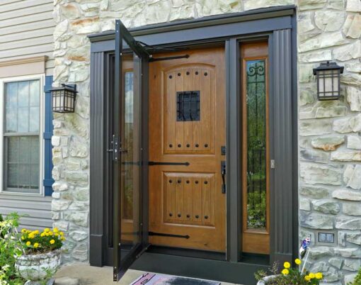 {Signet® 002CP-437 entry door in Caramel stain with a Speakeasy and an open storm door}