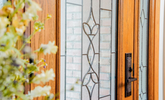 {ProVia Signet oak fiberglass entry door with Caramel stain and Esmond decorative glass}