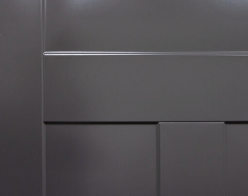 {Closeup example of a deep blue Legacy steel door with smooth skin and Shaker embossing}