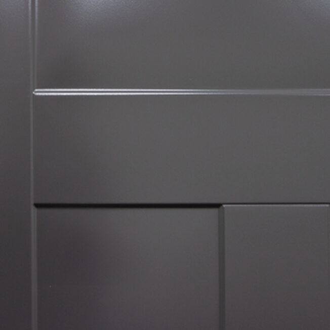 Closeup example of a deep blue Legacy steel door with smooth skin and Shaker embossing