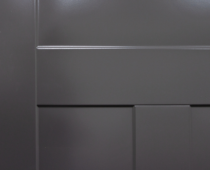 Closeup example of a deep blue Legacy steel door with smooth skin and Shaker embossing