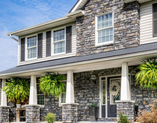 Picture of a two-story home with Terra Cut Stone Veneer, example of a home exterior stone application