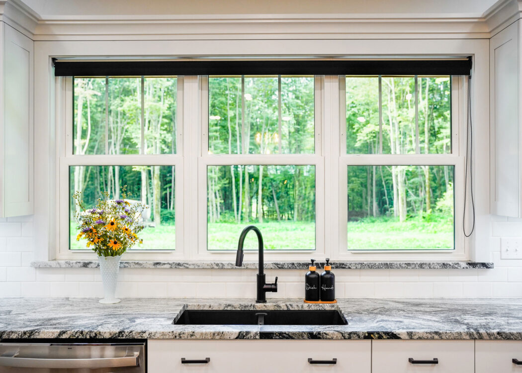 {Interior view of white Endure™ Double Hung Windows with Flat Internal Grids in a kitchen}
