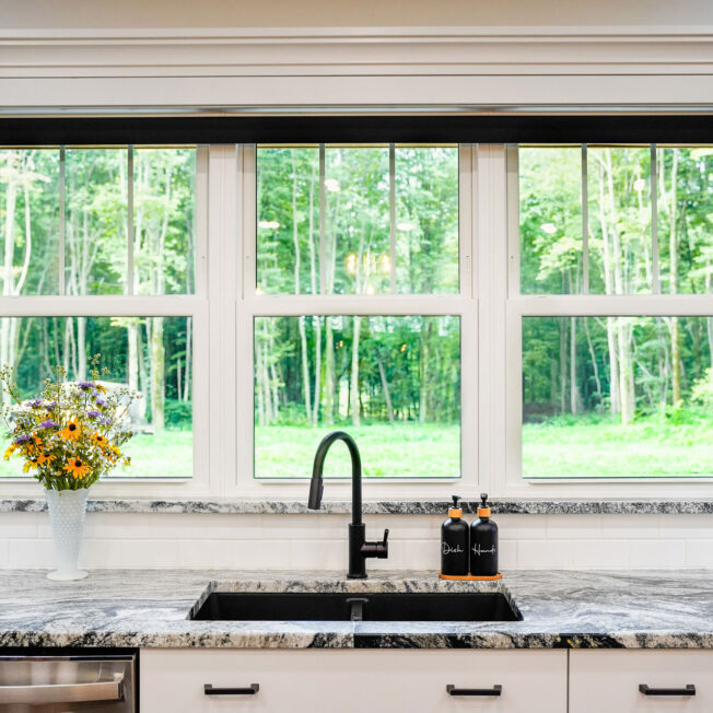 {Interior view of white Endure™ Double Hung Windows with Flat Internal Grids in a kitchen}