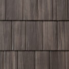 Closeup image showing the details of ProVia's Briarwood brown colored shake metal shingle roof, example of metal roofing that looks like shake