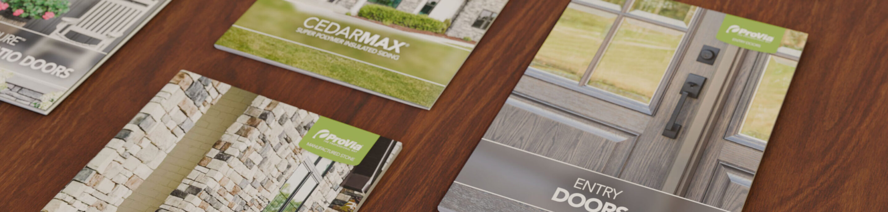 {ProVia brochures on a wooden table}