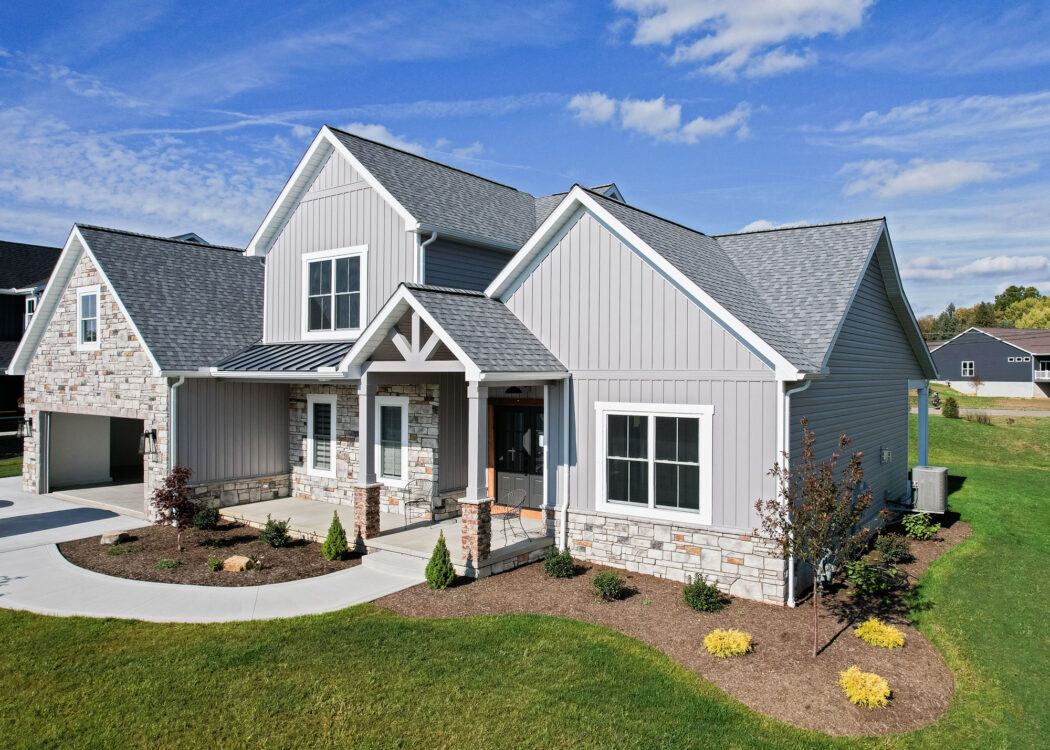 {Pewter HeartTech siding with Cedar Peaks board and batten on a newly constructed craftsman-style home}