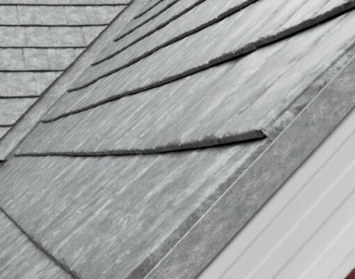 {Closeup of a roof on a home showing ProVia's Ironstone Slate metal roofing with Pepper Iron Decorative Trim}