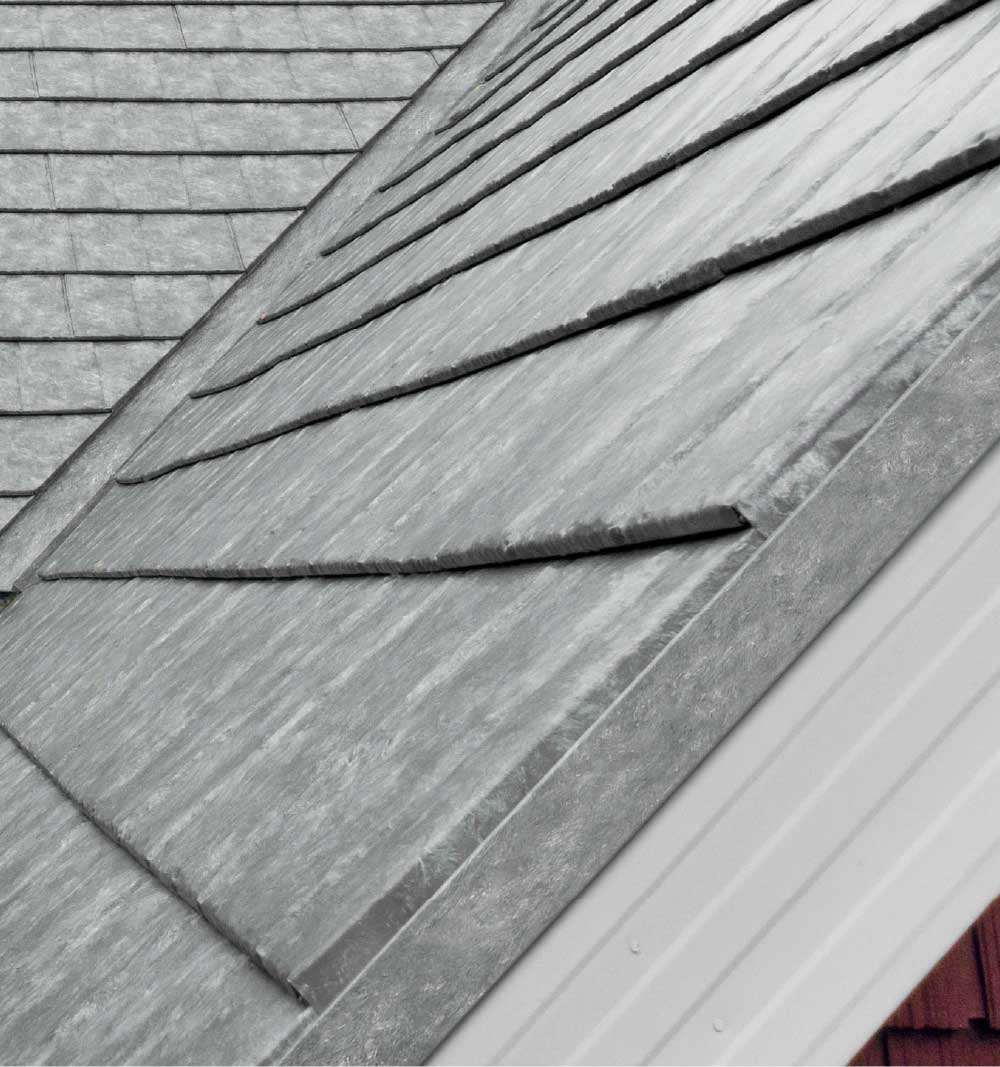 Closeup of a roof on a home showing ProVia's Ironstone Slate metal roofing with Pepper Iron Decorative Trim