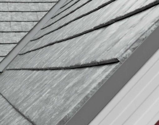 {Closeup of a roof on a home showing ProVia's Ironstone Slate metal roofing with Pepper Iron Solid Trim}