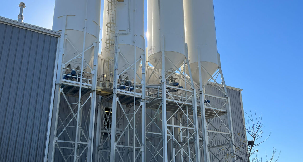 {Silos at ProVia's stone manufacturing plant for storing raw materials}