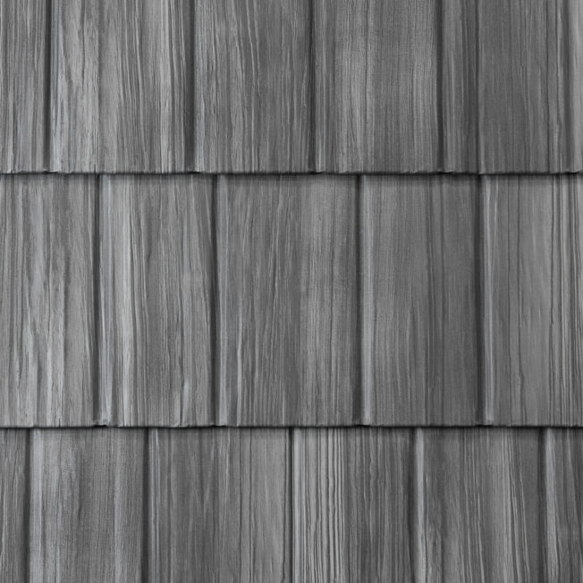 {Closeup image showing the details of ProVia's Pepperwood gray colored shake metal shingle roof}